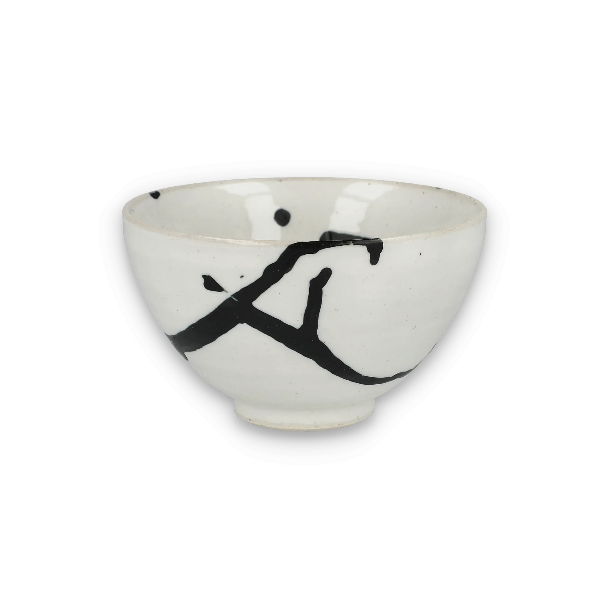 Weiße Keramikschale mit schwarzem abstraktem Pinselstrich- und Punktmuster