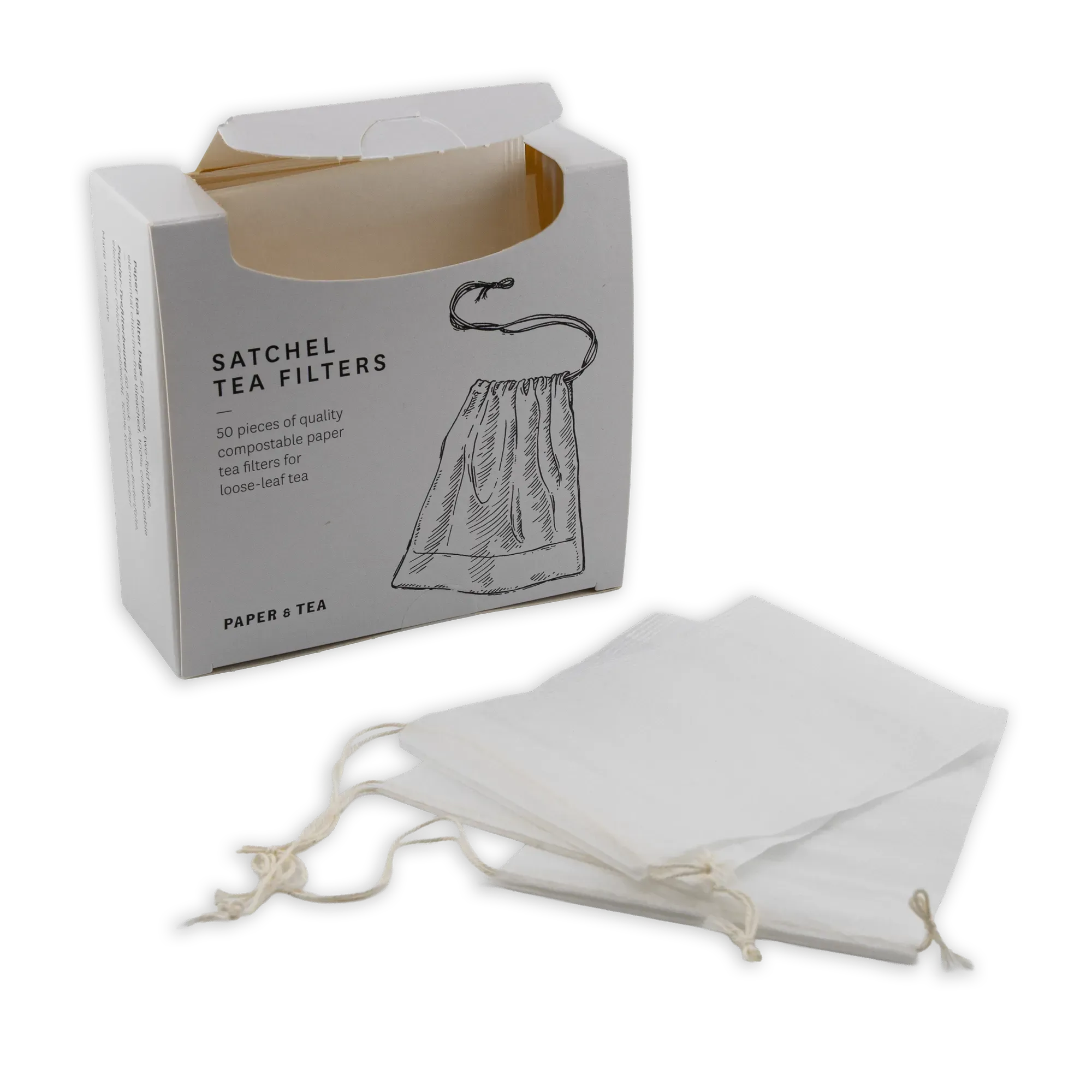 Weiße, kompostierbare Papier-Teefilter für losen Tee neben der Paper & Tea Verpackung.